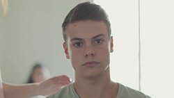 Teasing a handsome kid: two kiss Stock Footage