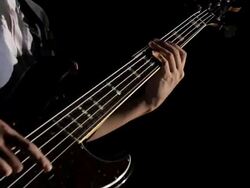 MS TD ZI Shot of Young man playing bass guitar / Shinjuku, Tokyo, Japan Stock Footage