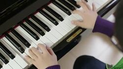 boy playing the piano Stock Footage