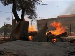 WRAP Firefighters scramble to tame fires; ADDS children at shelter News Clip