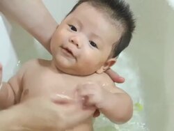 Baby taking a bath Stock Footage