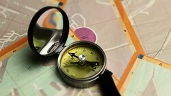 The compass indicates the right path on map of city in italy Stock Footage
