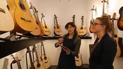 Saleswoman holding digital tablet while communicating with customer Stock Footage