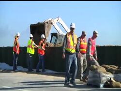Crews in Hamburg, Iowa, are continuing to bolster a temporary levee as Missouri River floodwaters roll toward the town.  Should the new levee fail, parts of Hamburg could be submerged under as much as 10 feet of water within days. Instructional Video