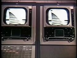 1962 two television monitors showing American flag / broadcast from first communications satellite Stock Footage