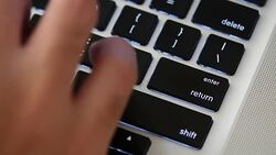 Hand typing a laptop Stock Footage