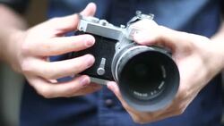 CU TU Young man taking pictures with digital camera Stock Footage