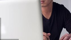 HD DOLLY :  Asian man working on table Stock Footage
