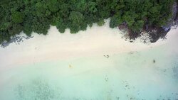 Sea kayaking with two people across a tropical reef in the Andaman sea in the Burmese archipelago Stock Footage