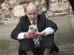 HD DOLLY: Businessman Begging On The Street Stock Footage