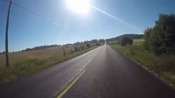 A rural road on San Juan Island near Lime Kiln State Park on a warm sunny day. Stock Footage