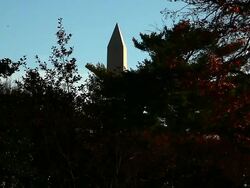 Long distance static shot of the top of the Washington Monument in Washington DC Stock Footage