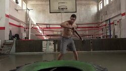 Hammer hitting tire Stock Footage