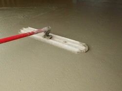 Worker Using a Bull Float to Smooth Concrete Stock Footage