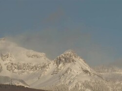 MS View of Clouds and Snow Rolling over Majestic Mountain Peaks in evening Light / Telluride, Colorado, United States Stock Footage