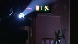 A crosswalk symbol shines behind the beam of a spotlight. Stock Footage