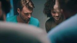 Guys playing tabletop soccer in apartment Stock Footage