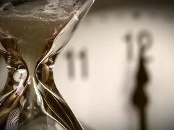 Alarm clock and Hourglass - 12.00 clock Stock Footage