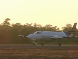 MS TS View of Light Aircraft on Runway for Takeoff at Dusk / Truscott, Western Australia, Australia Stock Footage