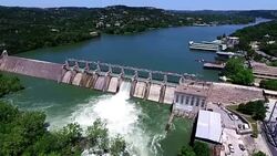 Fast Motion Aerial Open the Flood Gates Colorado River Dam Aerial View Austin Texas Stock Footage