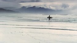 Pacific City State Park beach Oregon with surfer and storm 5 Stock Footage