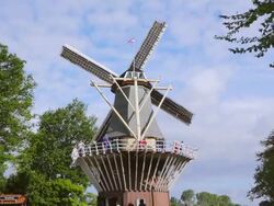 WS LA View of people on top deck of windmill at Keukenhof Gardens / Lisse, South Holland, Netherlands Stock Footage