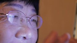 close-up of old woman using mobile phone at home Stock Footage