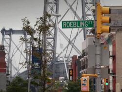 Roebling Street sign with the Manhattan Bridge behind Stock Footage