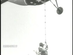 1951: KOREAN WAR: U.S. AIRLIFT: * VS United States Marines helicopter (airborne mission) flying, Marines climbing down rope from small airlift. VS Transport helicopter landing, soldiers getting out. 38th Parallel Instructional Video