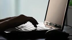 Close up of a hand typing on laptop keyboard Stock Footage