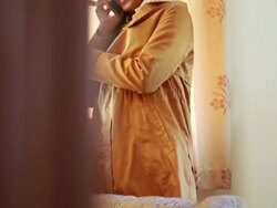 Season winter a woman talking phone in the room Stock Footage