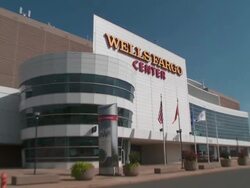Close up of the Wells Fargo Center sign in Philadelphia, Pennsylvania. Shot pulls out revealing the arena Stock Footage