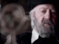 A man in period clothing frowns near an armillary sphere. Stock Footage