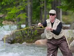 Fly Fishing in Mountain River Stock Footage