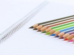 HD DOLLY: Color Pencils And Spiral Notebook Stock Footage