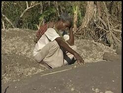 Rural villagers in Bangladesh are doing what they can to bury the dead and clean up after last week's cyclone that killed more than 3,000 people. News Clip