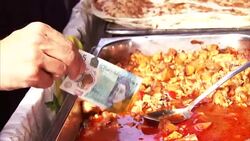 Mark Carney dips new ï¿½5 note in curry News Clip