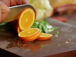 Chef Slicing Orange Stock Footage