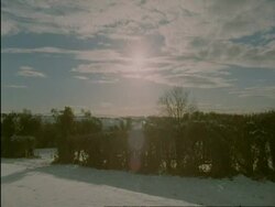 WA cotswold countryside in snow, sun and lens flare, Cotswolds, England Stock Footage