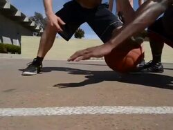 DS TS Dolly of male basketball players dribbling the basketball. Stock Footage
