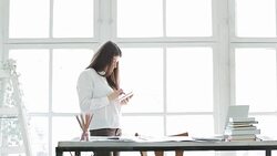 Businesswoman using digital tablet and laptop in her office. Stock Footage