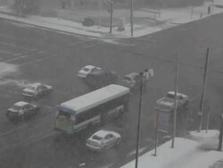 Winter Intersection, Traffic in Falling Snow Stock Footage