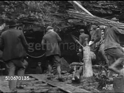 1925: TRAPPED: Headlines 'Man buried...still alive', Rescuers at entrance to cave of caver Floyd Collins, VS Illustrations of where Floyd trapped, men w/ rescue equipment, men walking up mountainside, prayer service outside. (Floyd lived 18 days) Instructional Video