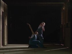 two dancers dancing together in wooden barn Stock Footage
