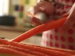 Woman peels carrots Stock Footage