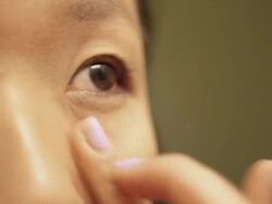 Asian woman applying make up(toner) Stock Footage
