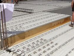 MS TS Shot of workmen spraying liquid on wood on house building at construction site / Hermeskeil, Rhineland Palatinate, Germany Stock Footage