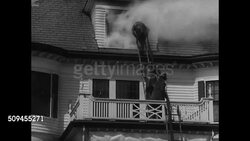 1936: FIREFIGHTERS TO FIRE: INT Burning building. Firemen climbing ladder w/ hose up to upper floor residential house window, white smoke engulfing firefighter. INT Burning room. Firemen in smoke in burning room. Instructional Video