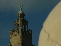 Liverpool, The Three Graces Front of the Liver & Cunard buildings from the Pier Head. War memorial, Liver bird, Statue in front of Classical 'Mersey Docks & Harbour Board' building. MDHB building facade and dome. 2004; short sequence. Model, Property, Nar Stock Footage
