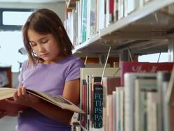 CU Student reading book in library / Santa Fe, New Mexico, United States Stock Footage